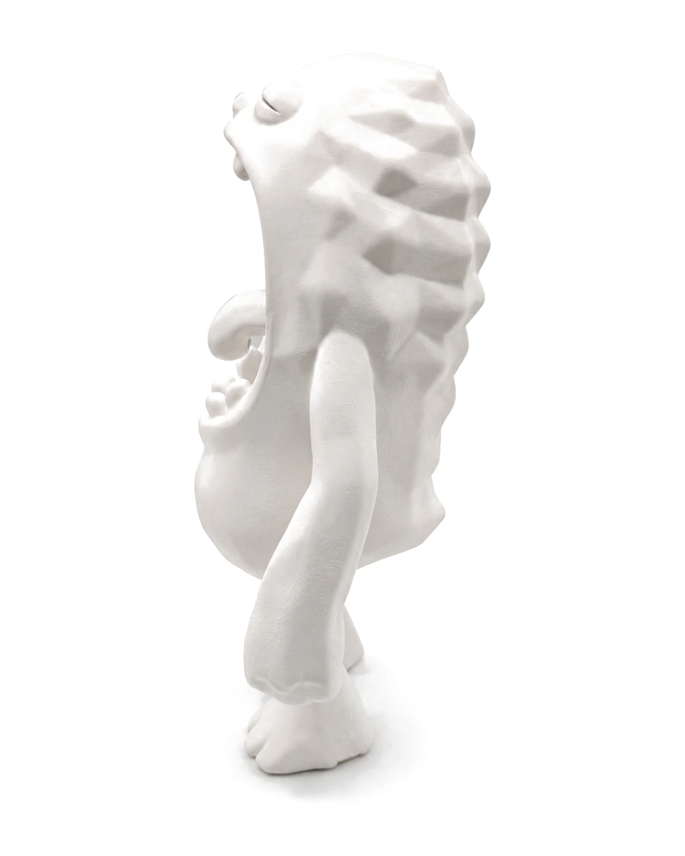 The creature in profile, its ridged back curving over a low-slung belly, arms hanging loose